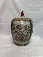 Front view of the Chinese porcelain ginger jar showing floral and bird decorations.