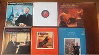 Full view of six classical music LP records in album covers featuring Arthur Rubinstein.