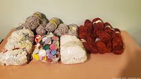 Full yarn lot showing all skeins and balls in various colors and textures, some new, some used.