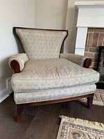 Pair of formal side chairs with taupe/grey upholstery and dark hardwood frames, showing shape and style.