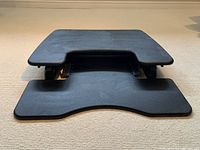 Front view of Varidesk Pro Plus 30 showing dual platform design and hinge area.