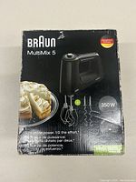 Box front of Braun MultiMix 5 hand mixer showing product, 350 watt power specification and accessories included.