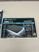 Fluval Sea Nano Marine Spectrum LED light box showing key features and packaging