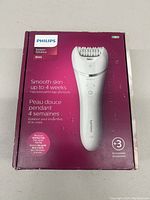 Front of Philips Epilator Series 8000 BRE720/14 box showing product image, features including smooth skin up to 4 weeks, and 3 accessories.