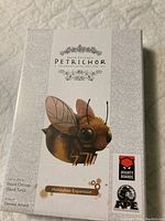 Front of game box showing the title and honeybee artwork