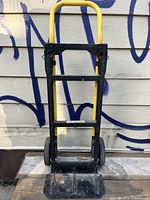 Front view of Harper task dolly with yellow handle and black frame