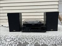 Full setup photo showing Audio Technica AT-LP60 turntable on top of Sony STR-AV220 amplifier with Profiles PSL-52B speakers on each side.