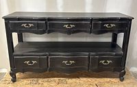 Front straight view showing three top drawers, open shelf and three bottom drawers, carved apron and cabriole legs