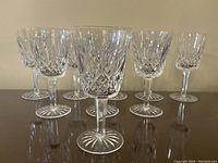 Front view of all eight glasses arranged in two rows