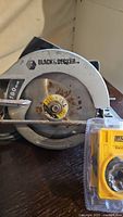 Photo of Black & Decker 7-1/4 inch circular saw showing some rust on the blade and the brand logo.
