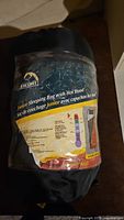 Photo showing the label of Escort Junior Sleeping Bag with Hot Hood in storage bag.