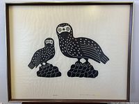 Full view of framed stone cut lithograph depicting two birds