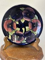 Front view on stand showing pansy pattern and overall condition