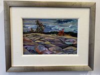 Straight-on view of framed landscape painting showing full artwork and frame