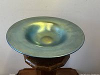 Top-down view showing flared rim, shallow center, foot