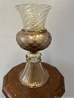 Front view of full vase on stand