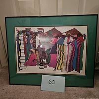 Full front view of framed artwork showing green mat and black frame