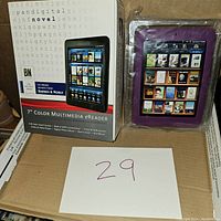 Barnes & Noble 7-inch color multimedia eReader with original box and purple protective case shown, device inside case.