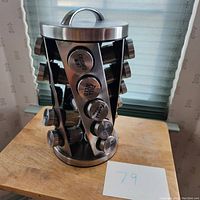 Full view of the rotating spice rack showing labeled spice jars including Crushed Chili, Dill Weed, Thyme, Parsley, Italian Seasoning, etc.