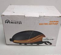 Box packaging of Outdoor Master Dolphin electric air pump with branding and product image visible.