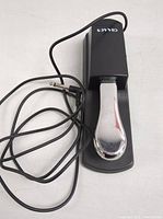 Sovvid electronic keyboard sustain pedal showing metal pedal and cable with straight plug end.