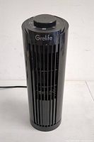 Front view of Grelife Elite tower fan showing vertical grille and top control knob