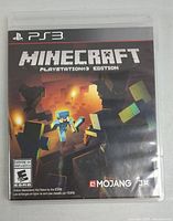 Front cover of Minecraft PlayStation 3 Edition case showing game title, rating, and art.