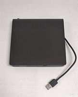 Top view of the black external ODD and HDD device with attached USB 3.0 cable.