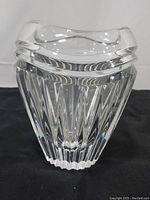 Front view of Waterford crystal vase showing the vertical prism cuts and scalloped rim.