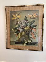 Full-view of framed chromolithograph hung on wall