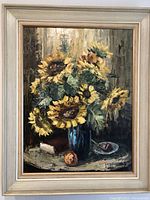 Full view of the oil on canvas still life painting showing sunflowers, book, pipe, ashtray, and peach in original frame.