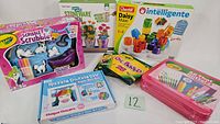 Full lot showing all included items: Stoneware Garden Kit, Crayola Scribble Scrubbie Pets, Daisy Maxi peg game, Razzle Dazzle Gem Art Kit, Oil Pastels, All That Glitters Set.
