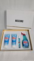 Full gift set with four cosmetic items inside white box with Moschino branding