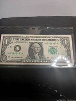 Front view of the 2017 US one dollar star note showing George Washington portrait and serial number H02663893.