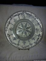 Top view of vintage Federal Heritage glass plate showing detailed pressed floral and geometric pattern