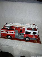Side view of Funrise Metro City Fire Department Engine #36 toy fire truck showing details and colors