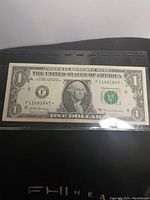 Front side of the 2017 George Washington one dollar star note showing serial number and portrait.