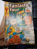Single cover close-up of Fantastic Four issue #108 showing damage and wear, surfaced text and characters, comic priced at 15 cents.