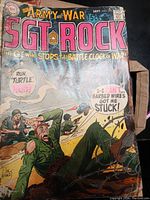 Cover of Our Army at War: Sgt. Rock #233 showing soldiers in battle with speech bubbles, visibly worn and creased