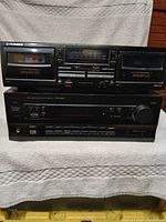 Front view of Pioneer CT-W4000 double cassette deck on top and VSX-409 multi-channel receiver below showing controls and display displays