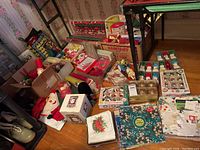 Overview of all wrapping supplies and decorations on floor