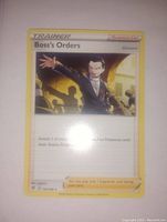 Front image of 'Boss's Orders' Pokémon Trainer card showing artwork, text, and overall condition.