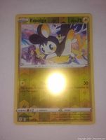 Clear image of the Emolga Reverse Holo Pokemon Card, showing the card art, electric type symbol, and 70 HP.