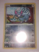 Front view of the Glameow Pokemon card showing holo foil design and character artwork.