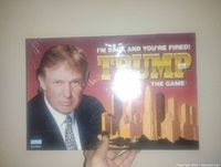 Front view of the sealed Donald Trump board game box showing the image of Donald Trump and game title.