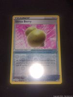 Photo of a single Sitrus Berry Pokémon Trainer card in high-grade condition with holographic effect and yellow border.