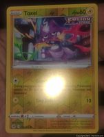 Photo of Toxel Fusion Strike reverse holo Pokemon card showing artwork, stats, and details.