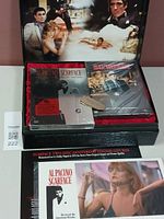 Open box set showing printed movie character collage on inner lid, two DVD cases inside, one sealed.