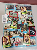Photo of assorted unused Star Wars stickers including Luke Skywalker, Obi-Wan Kenobi, Princess Leia, Tusken Raider, and Star Wars logo stickers.