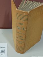 Spine of the book showing the title, author, and publisher printed on yellow hardcover with blue text.